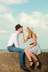 Loving couple retro style dating on sea coast