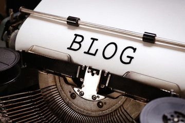 Old typewriter with paper, close up. Blog concept