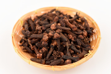 Dry Clove, medicinal herbs on a white background.
