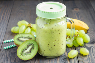 Healthy smoothie with kiwi, green grape, and banana in jar