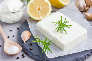 Ingredients for feta, cream cheese, rosemary, lemon and garlic dip