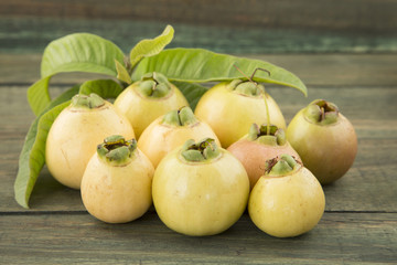 Syzygium Jambos on the wooden table.