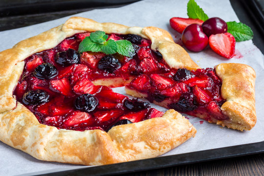 Cottage cheese dough galette with strawberry and cherry, horizontal