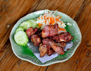 Fried sparerib on wooden background