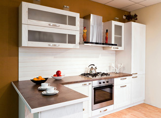 Luxurious new white  kitchen with modern appliances - 117045197