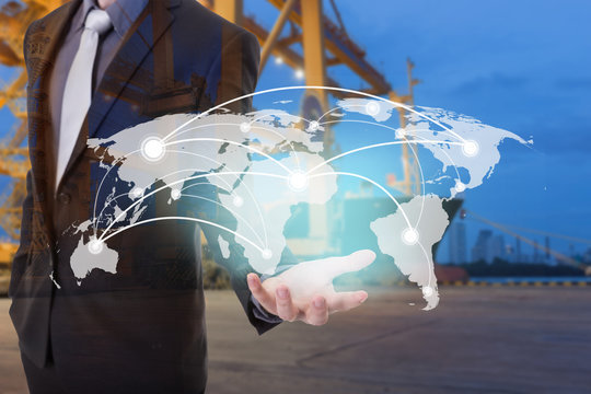 Global network coverage world map on hand of businessman ,Industrial Container Cargo freight ship at habor for Logistic Import Export background (Elements of this image furnished by NASA)