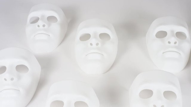 Sad white opera masks