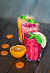 Fresh Fruit Smoothies. Assorted fruit smoothies on a wooden table. smoothie concept