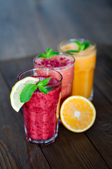 Fresh Fruit Smoothies. Assorted fruit smoothies on a wooden table. smoothie concept