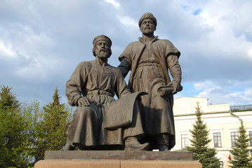 Fototapeta premium The sculpture of the architects of the Kazan Kremlin closeup, cloudy april day. Kazan, Tatarstan