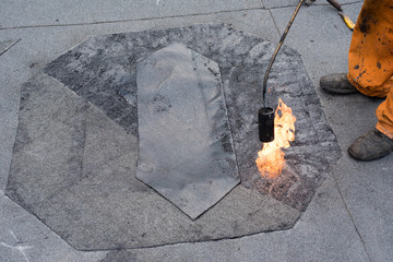 Roofer doing repair roof drain.