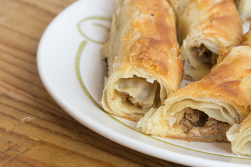 Sliced burek with meat on the plate