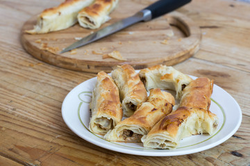 Sliced burek with meat on the plate