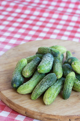Fresh pickles on the wooden board