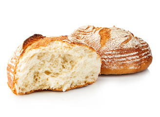 Fresh grain homemade bread cut in half on white background.