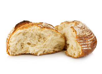 Fresh grain homemade bread cut in half on white background.