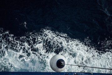 Buoyant ball from a cruising catamaran