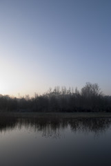 Obraz premium Sunrise over frozen landscape.
