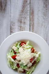 Salad with chicken, mozzarella and cherry tomatoes.