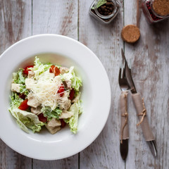 Salad with chicken, mozzarella and cherry tomatoes.