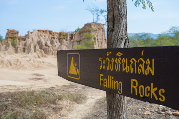 Land Texture with warning signage of falling rocks at Na Noi earth pillar in Nan, Thailand