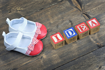 Kid shoes and word Idea