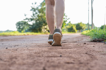 Woman walking on the street alone.