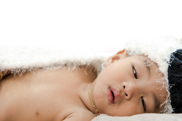 Asian baby boy sleep on the bed , white background