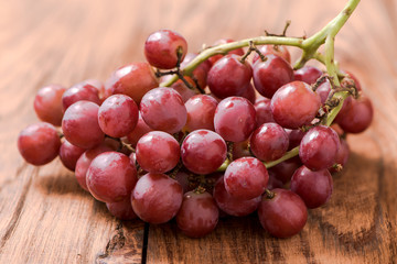 Grapes on wooden table