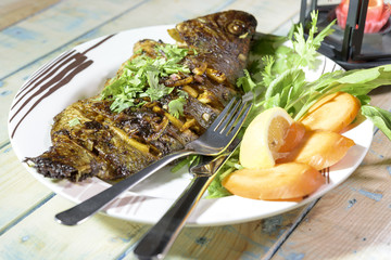 Oven Baked Tilapia fish with vegetables and Spinach.