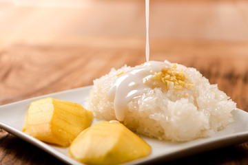 Mango with Sticky Rice on wood table