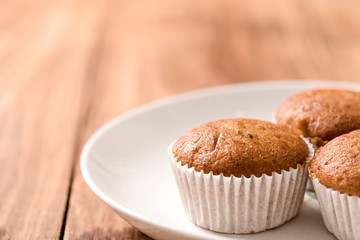Banana cup cake in plate on wood table