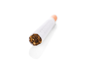 Tobacco in cigarettes close-up on a white background.