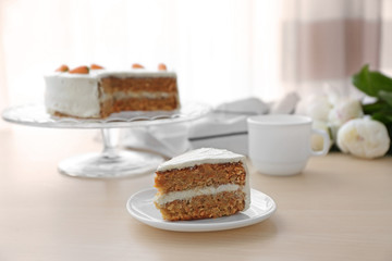 Tasty slice of carrot cake on white plate