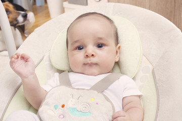 Close/up of a baby in his swing