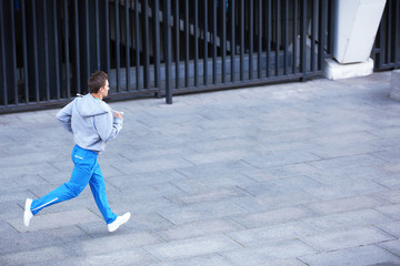 Young man running on the street