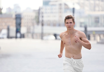 Young man running on the street