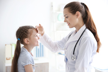 Fototapeta premium Cute girl visiting doctor