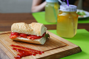 Tasty sandwich and cold drink on the table