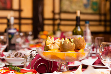 Table in a restaurant with a plate of fruit
