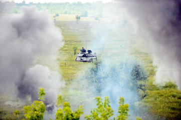 Main battle tank at a firing range in summer day