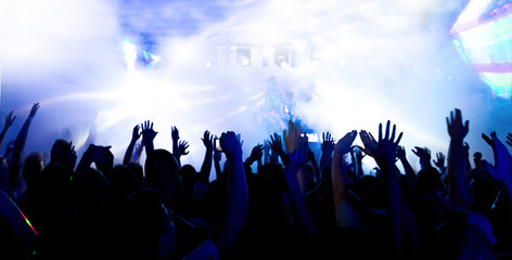 silhouettes of massive crowd at party concert club music happy