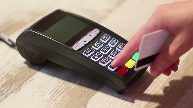 Hand dialing pin code holding credit card