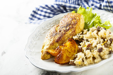 Fried chicken with oranges and couscous