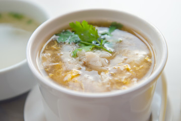 Bamboo and crab soup served with coriander vegetable leaf © suradech_k