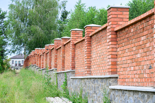 High red brick fence