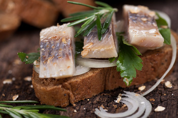 Salty fish slices on a bread
