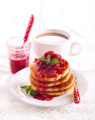 Pancakes with raspberry and peach coulis