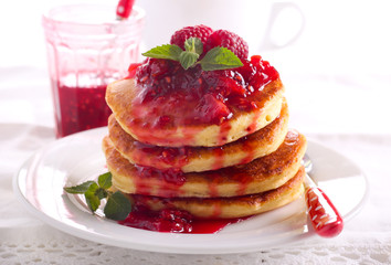 Pancakes with raspberry and peach coulis