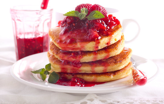 Pancakes with raspberry and peach coulis